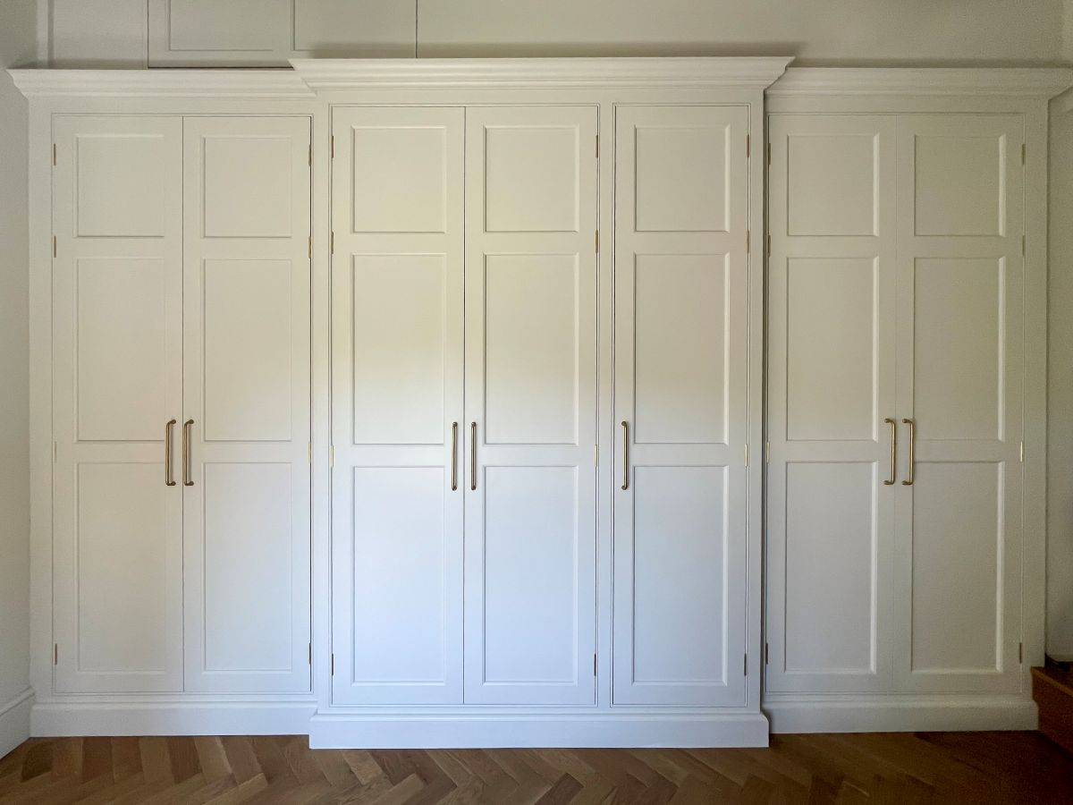 Bespoke break-fronted wardrobes hand-painted in off-white