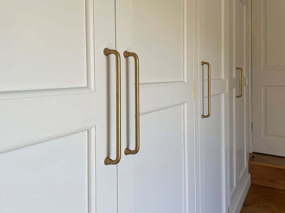 Close up of brass handles on the wardrobes